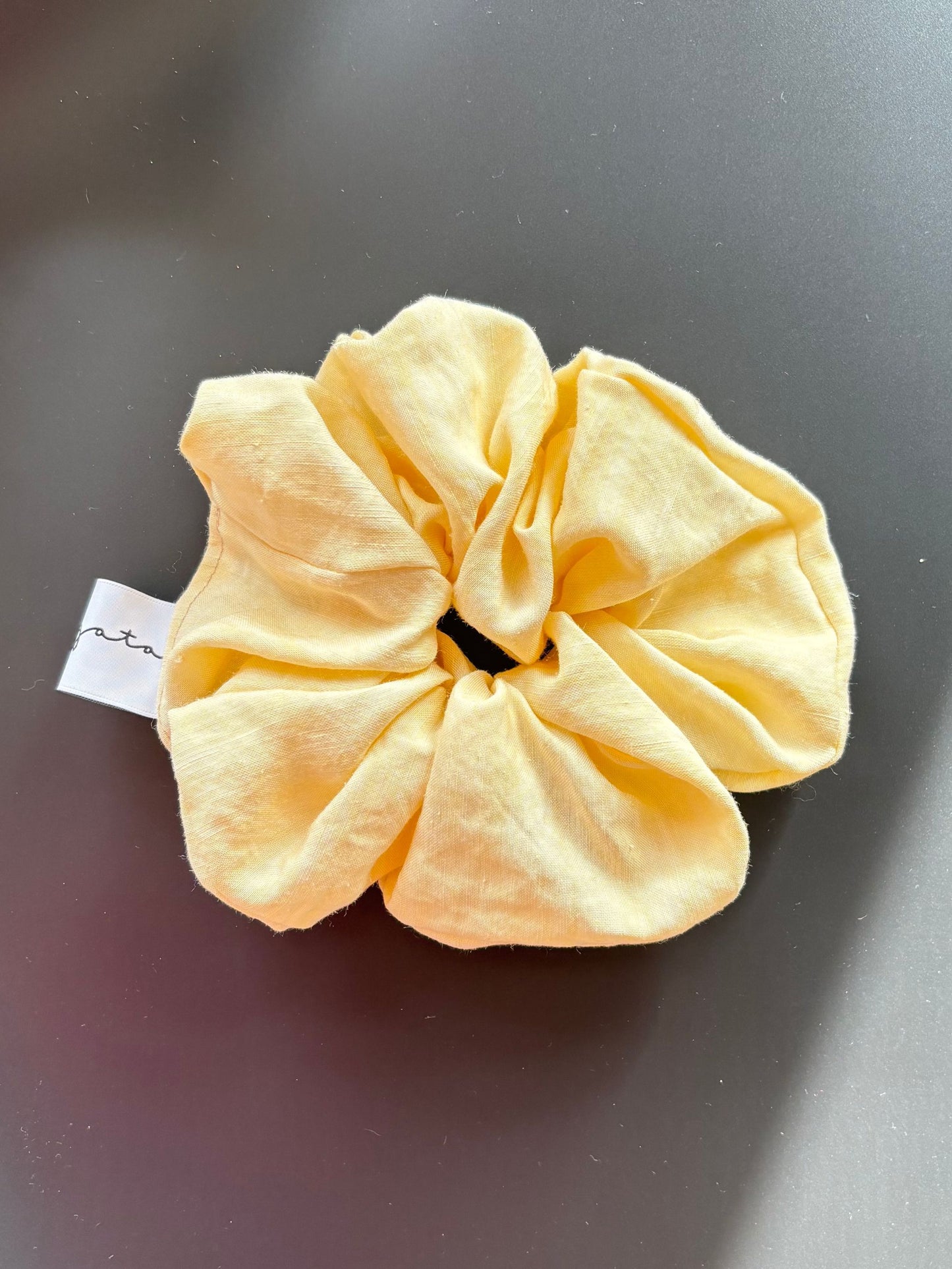 Magata Puff scrunchie yellow linen on black background