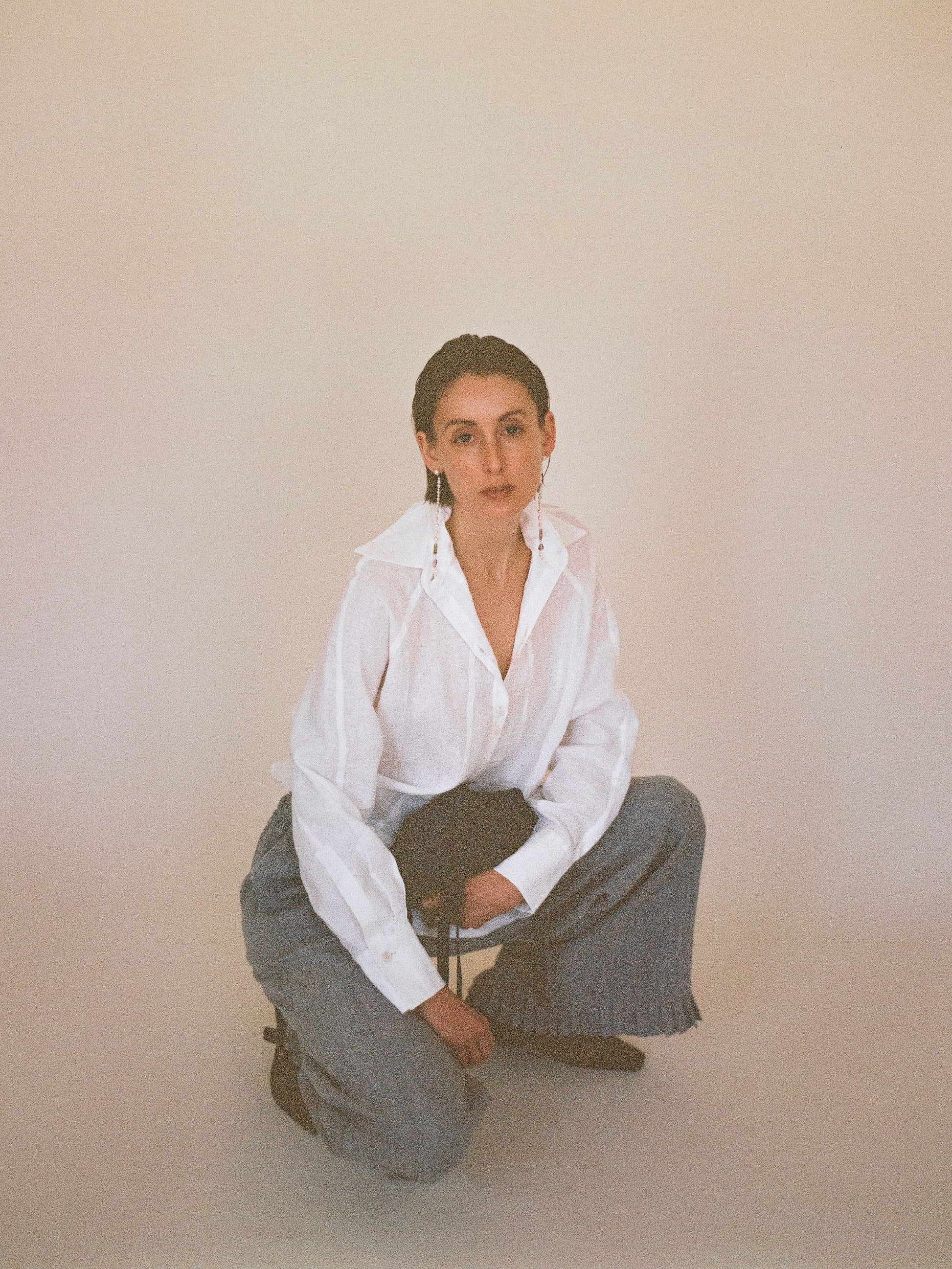 Atelier Magata Ivory white linen shirt with side slit and blue hemp ruffle trousers