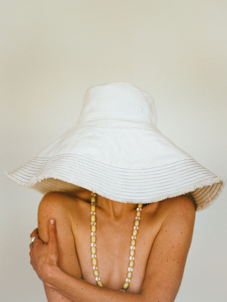 Atelier Magata Shade Bloom Sun Hat off white cotton yellow gemstone beaded necklace grand brim
