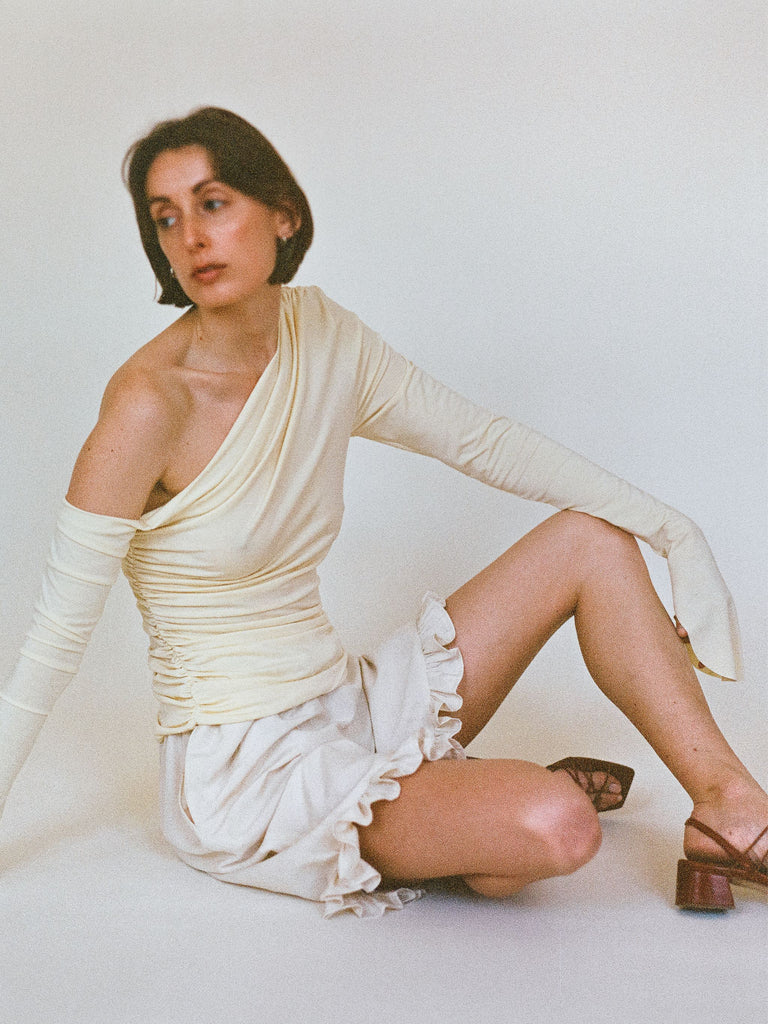 SS25 Atelier Magata Butter Yellow Top Asymmetric Shoulder Long Sleeves red sandals off white ruffle shorts